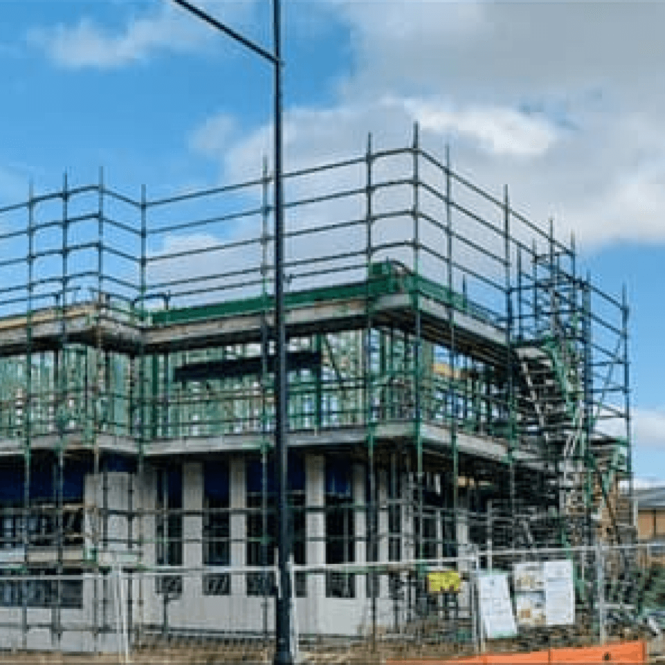 Scaffolding supporting a two-storey dwelling and granny flat in Bardia